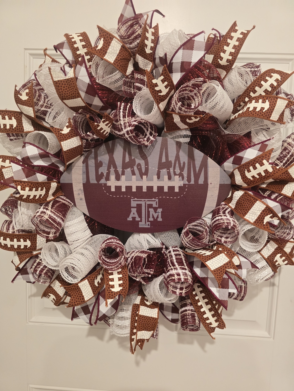 W163 – Texas A&M Football Wreath
Handmade Texas A&M football wreath featuring cl